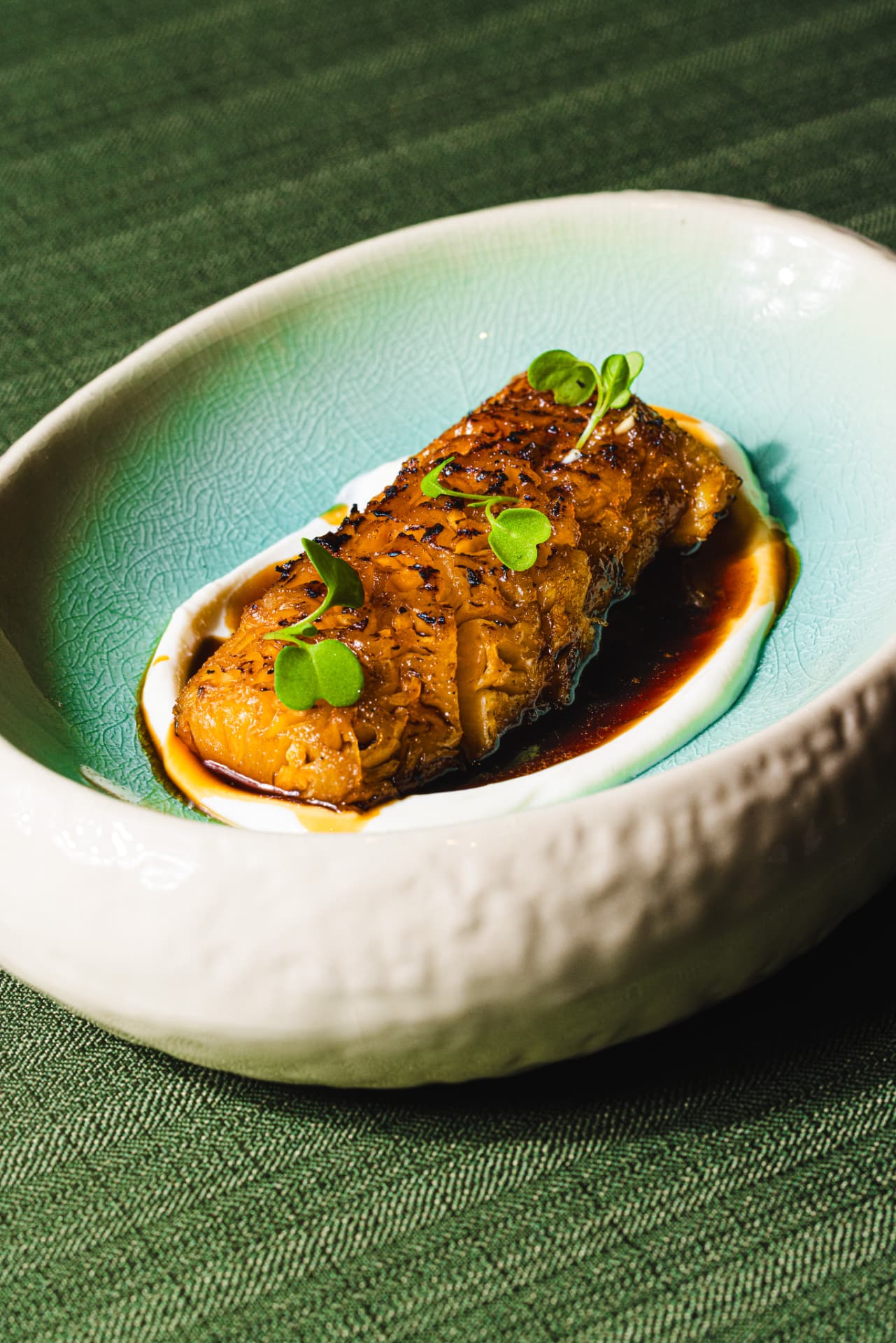 Caramelised glazed fish fillet in soy jus with cress at The Margin
