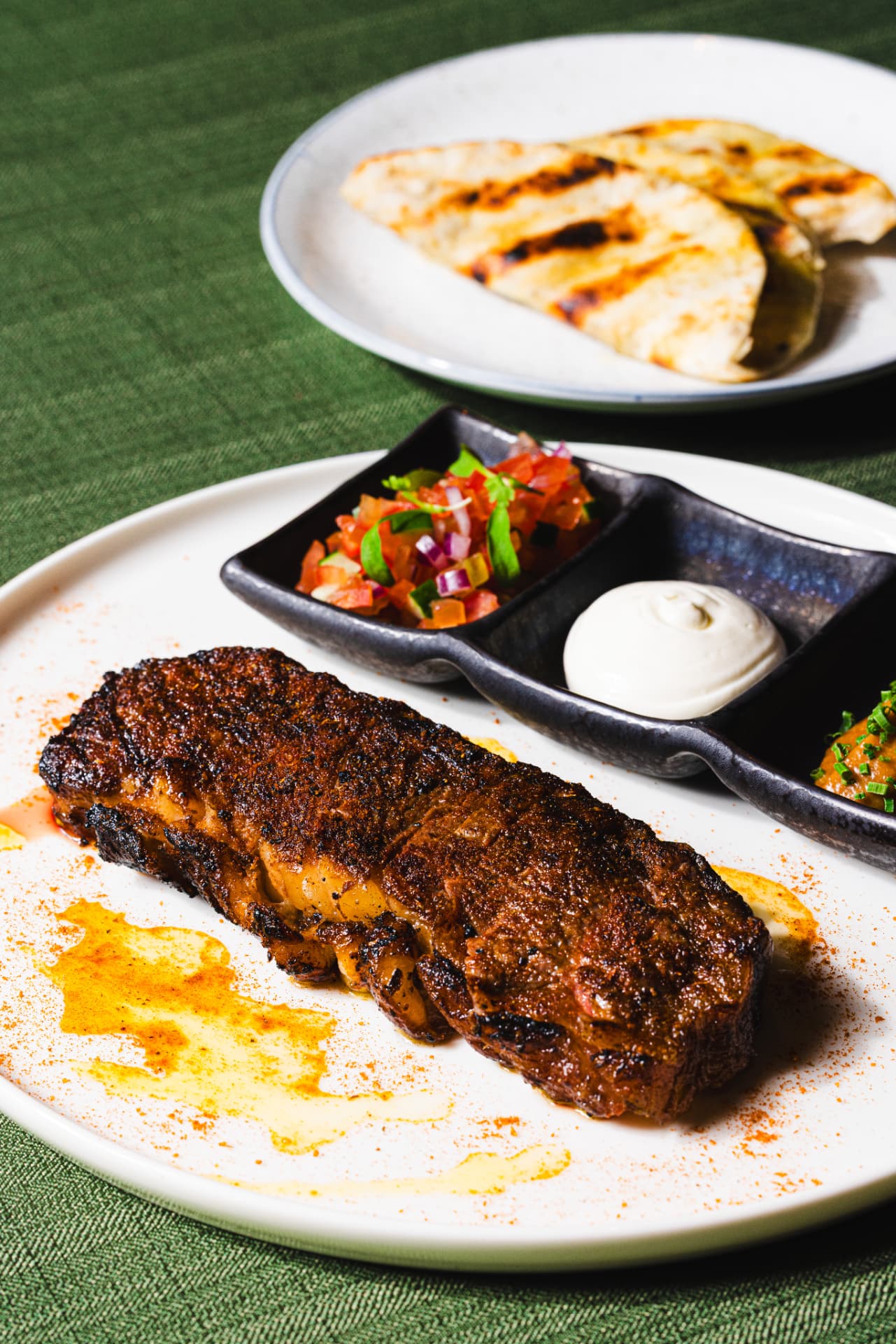 Charred dry-aged steak with grilled flatbread at The Margin