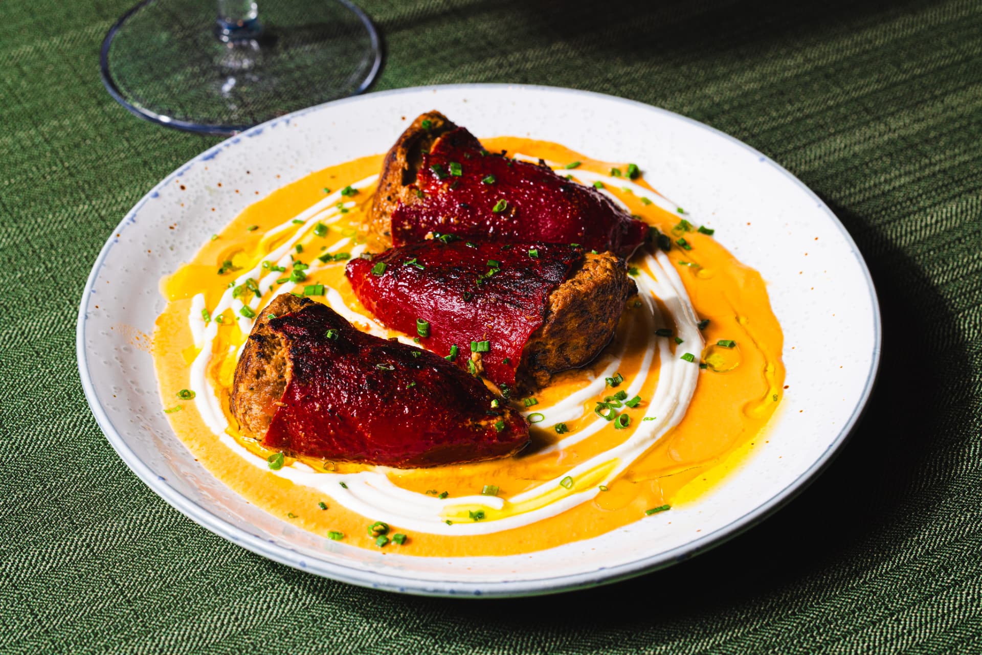 Close-up of stuffed piquillo peppers in shellfish bisque at The Margin