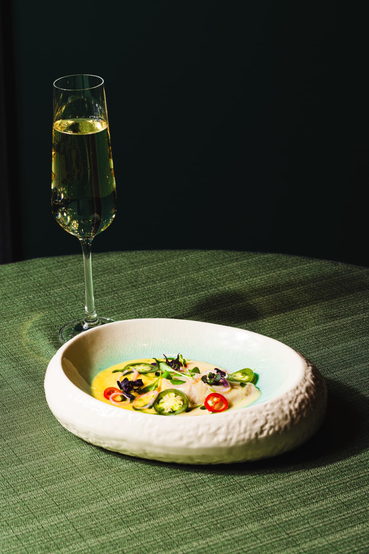Delicate fish in citrus butter sauce with jalapeño and champagne at The Margin