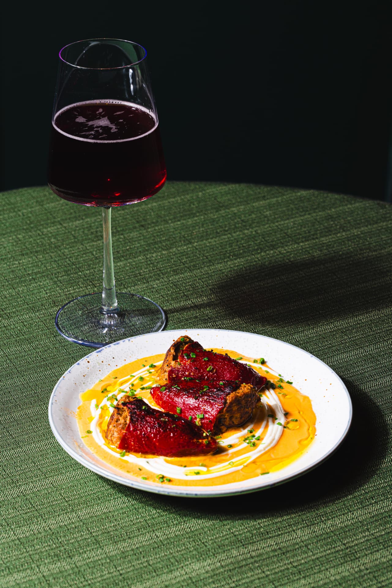 Stuffed piquillo peppers with bisque and chives, paired with red wine